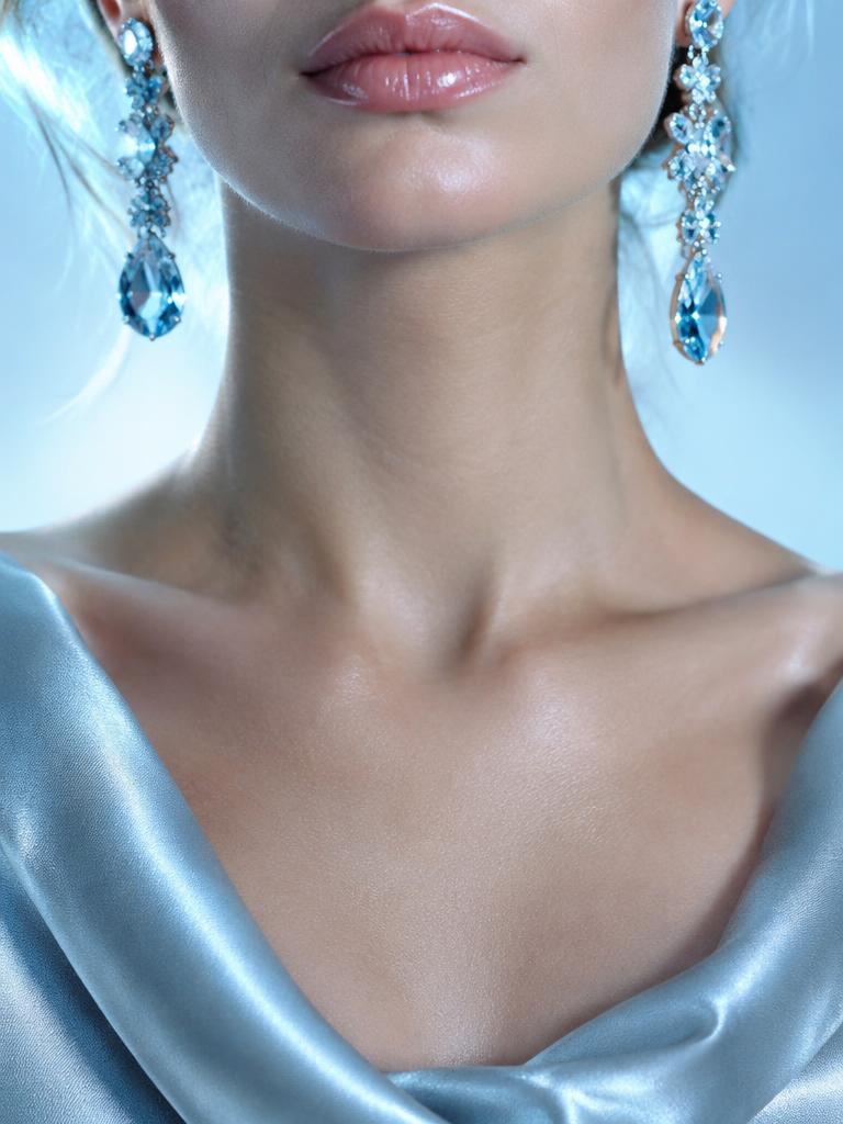 Crystal drop earrings and ice-blue satin neckline